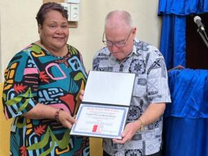 Vani Tera receiving her PIBC diploma from director Robert Martin